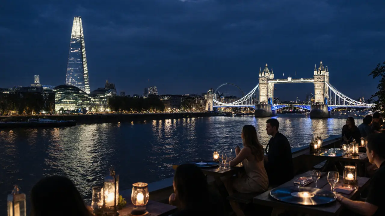 Rooftop bar high above the Thames at night, with city lights and bridge reflections glowing on the water below.