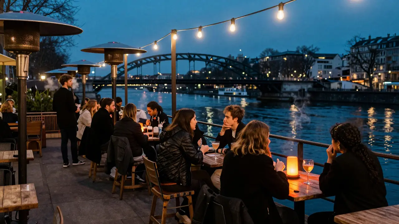Friends socializing on a lit terrace near the Canal Saint-Martin